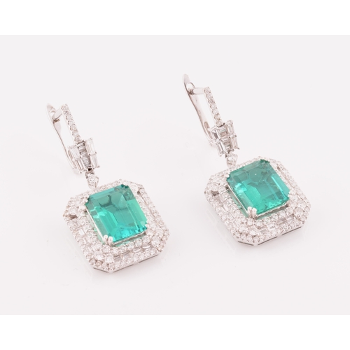 34 - A pair of 18ct white gold, diamond, and emerald pendant drop earrings, each set with a mixed emerald... 