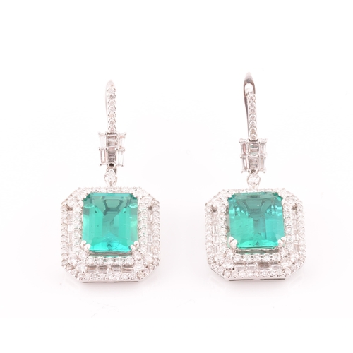 34 - A pair of 18ct white gold, diamond, and emerald pendant drop earrings, each set with a mixed emerald... 