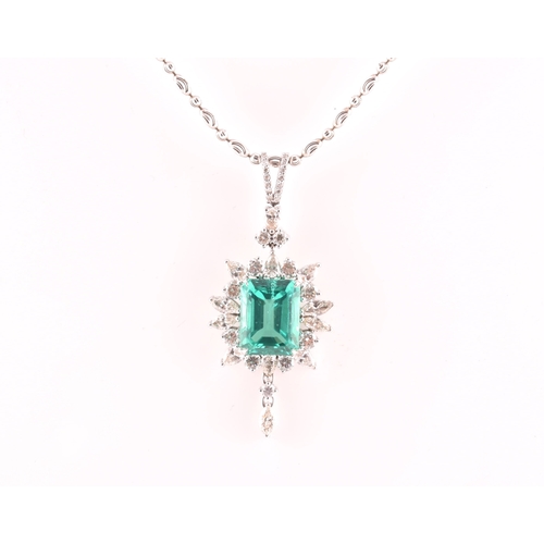 36 - An impressive diamond and emerald drop pendant necklace, set with a (synthetic) hydrothermal emerald... 