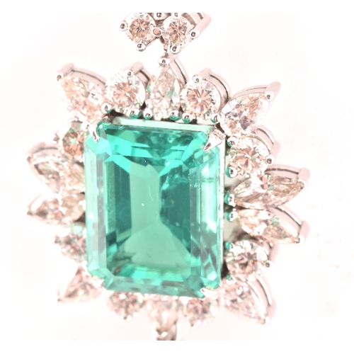 36 - An impressive diamond and emerald drop pendant necklace, set with a (synthetic) hydrothermal emerald... 