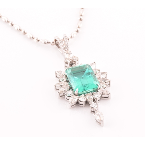 36 - An impressive diamond and emerald drop pendant necklace, set with a (synthetic) hydrothermal emerald... 