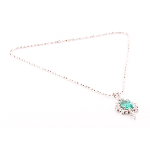 36 - An impressive diamond and emerald drop pendant necklace, set with a (synthetic) hydrothermal emerald... 