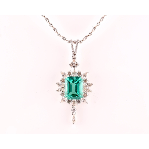 36 - An impressive diamond and emerald drop pendant necklace, set with a (synthetic) hydrothermal emerald... 