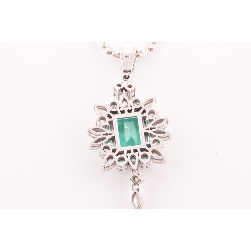 36 - An impressive diamond and emerald drop pendant necklace, set with a (synthetic) hydrothermal emerald... 