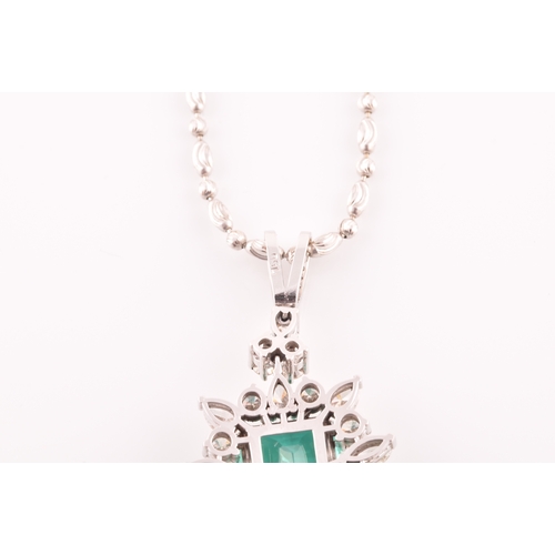 36 - An impressive diamond and emerald drop pendant necklace, set with a (synthetic) hydrothermal emerald... 