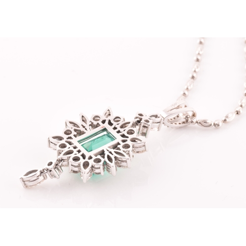 36 - An impressive diamond and emerald drop pendant necklace, set with a (synthetic) hydrothermal emerald... 