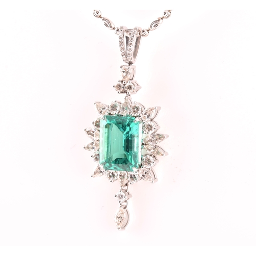 36 - An impressive diamond and emerald drop pendant necklace, set with a (synthetic) hydrothermal emerald... 