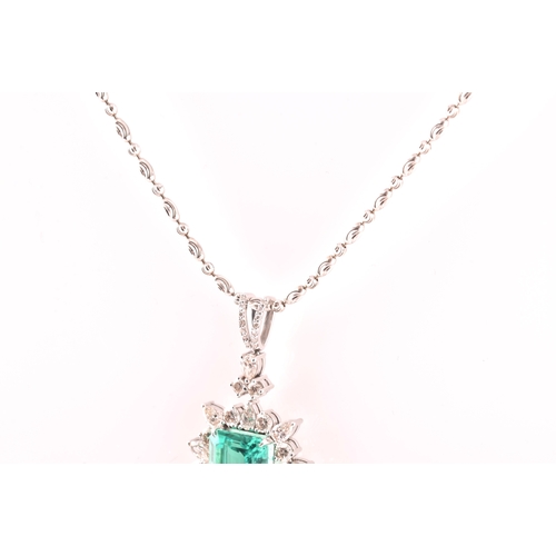 36 - An impressive diamond and emerald drop pendant necklace, set with a (synthetic) hydrothermal emerald... 