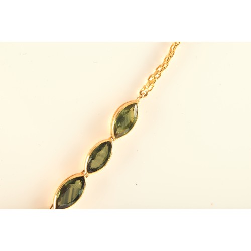 37 - A high carat yellow gold and green sapphire necklace, comprised of bezel-set mixed marquise-cut gree... 