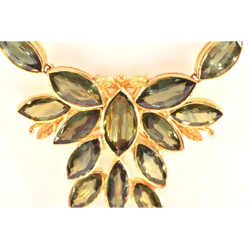 37 - A high carat yellow gold and green sapphire necklace, comprised of bezel-set mixed marquise-cut gree... 