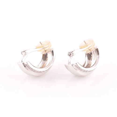 39 - Chopard. A pair of 18ct white gold and diamond earrings, in the La Strada design, the curved half ho... 