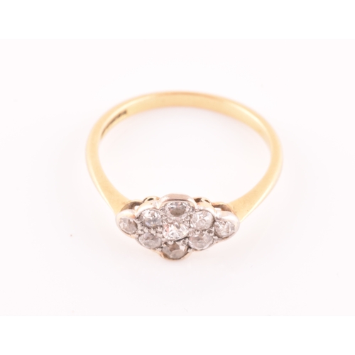 40 - An 18ct yellow gold and diamond navette ring, set with nine old-cut diamonds, ring mount measuring a... 