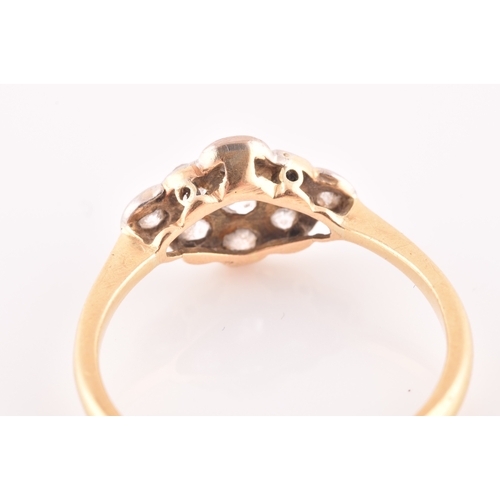 40 - An 18ct yellow gold and diamond navette ring, set with nine old-cut diamonds, ring mount measuring a... 