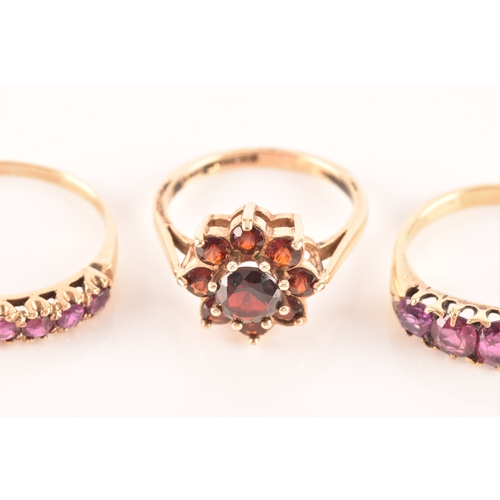 49 - An 18ct yellow gold and purple spinel five stone ring, set with mixed cushion and round-cut spinels,... 