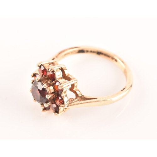 49 - An 18ct yellow gold and purple spinel five stone ring, set with mixed cushion and round-cut spinels,... 