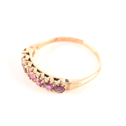 49 - An 18ct yellow gold and purple spinel five stone ring, set with mixed cushion and round-cut spinels,... 