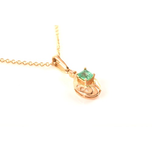 50 - A yellow gold and emerald pendant, set with a mixed rectangular-cut emerald, measuring approximately... 