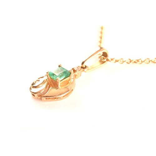 50 - A yellow gold and emerald pendant, set with a mixed rectangular-cut emerald, measuring approximately... 