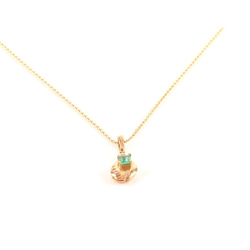 50 - A yellow gold and emerald pendant, set with a mixed rectangular-cut emerald, measuring approximately... 