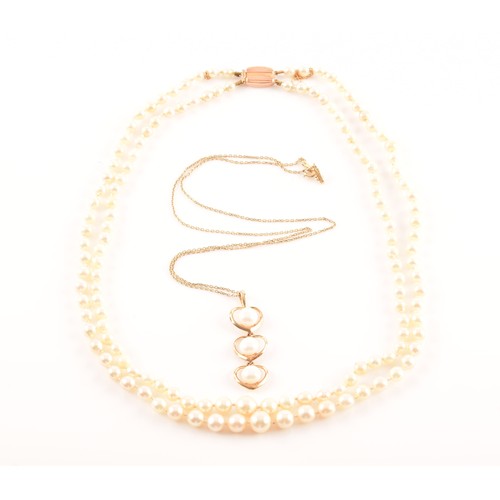 51 - A 14ct yellow gold and pearl pendant, the three heart-shaped segments each set with a white cultured... 