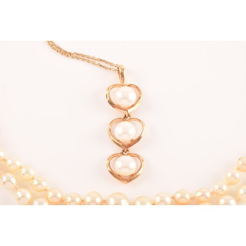 51 - A 14ct yellow gold and pearl pendant, the three heart-shaped segments each set with a white cultured... 