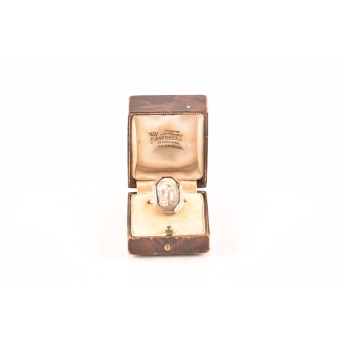 53 - An 18th century yellow gold mourning ring, the chamfered rectangular mount sent with an ivory plaque... 