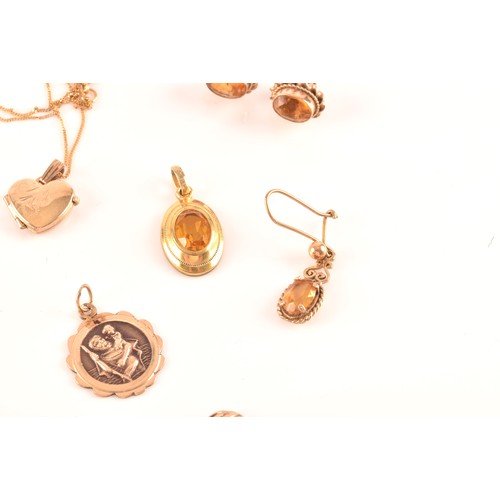 58 - A late 19th century yellow metal mounted citrine brooch set with an oval-cut citrine, 1.9 cm wide, t... 