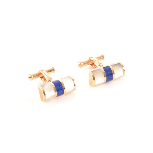 61 - A pair of 9ct yellow gold, lapis lazuli, and mother-of-pearl cufflinks, the smooth batons inlaid wit... 