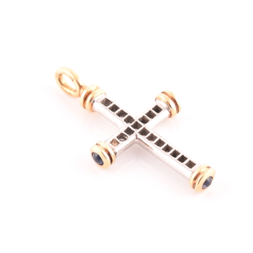 67 - An 18ct gold, diamond, and sapphire cross, the white gold cross mount inset with round brilliant-cut... 