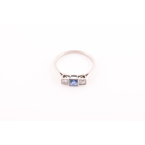 68 - A diamond and sapphire ring, set with a fancy square-cut sapphire, flanked with two round brilliant-... 