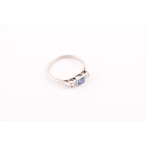 68 - A diamond and sapphire ring, set with a fancy square-cut sapphire, flanked with two round brilliant-... 