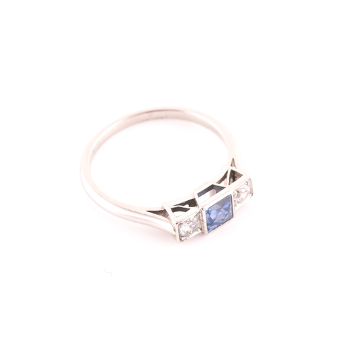 68 - A diamond and sapphire ring, set with a fancy square-cut sapphire, flanked with two round brilliant-... 