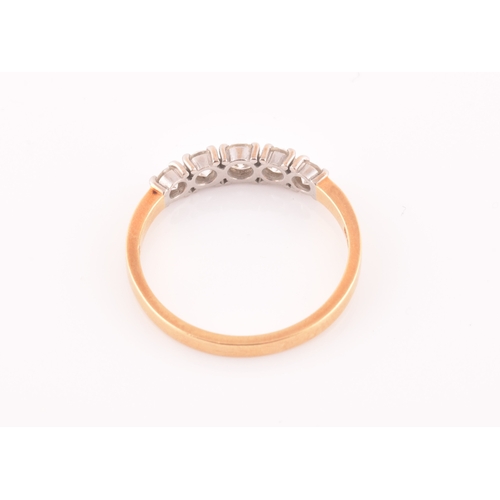 72 - An 18ct yellow gold and diamond ring, set with five graduated round-cut diamonds, the central diamon... 