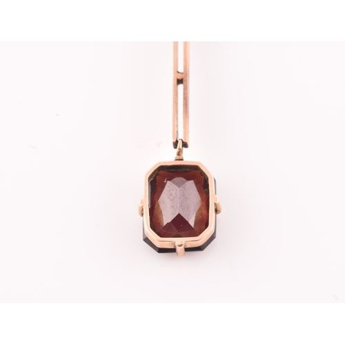 74 - An early 20th century 9ct yellow gold and garnet drop pendant necklace, together with a pair of yell... 