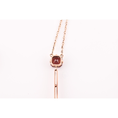 74 - An early 20th century 9ct yellow gold and garnet drop pendant necklace, together with a pair of yell... 