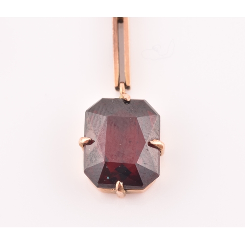 74 - An early 20th century 9ct yellow gold and garnet drop pendant necklace, together with a pair of yell... 