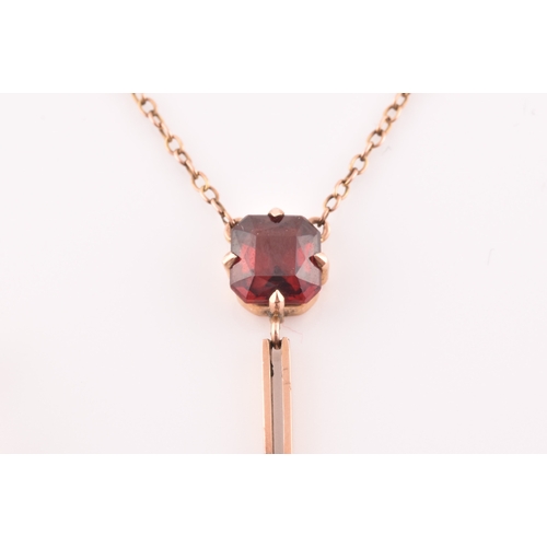 74 - An early 20th century 9ct yellow gold and garnet drop pendant necklace, together with a pair of yell... 