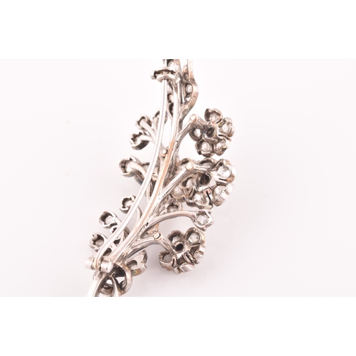 78 - A Victorian diamond floral spray brooch, the flowers and leaves inset with old-cut diamonds, the lar... 