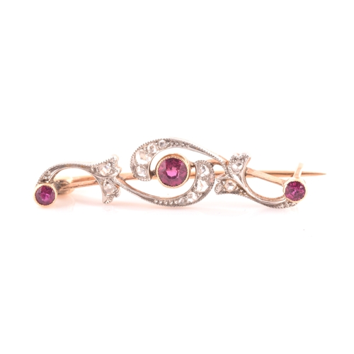 80 - A late 19th / early 20th century diamond and ruby bar brooch, the scrolled mount inset with old rose... 