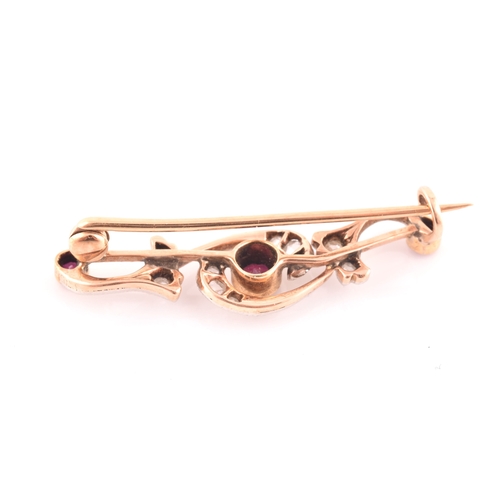 80 - A late 19th / early 20th century diamond and ruby bar brooch, the scrolled mount inset with old rose... 