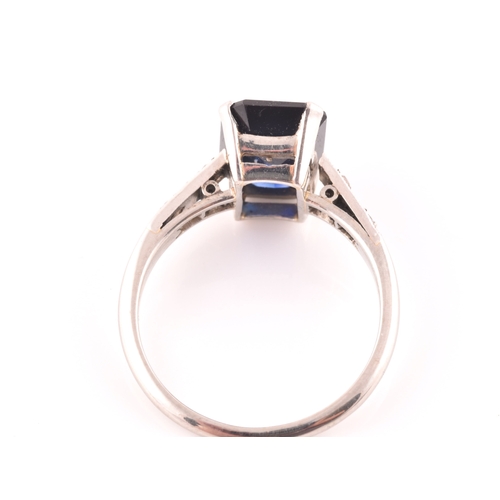 81 - An early 20th century platinum, diamond, and synthetic sapphire ring, set with a mixed rectangular-c... 