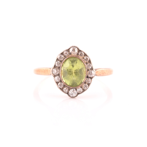 82 - A late 19th century peridot and diamond cluster ring, centred with a mixed oval-cut peridot, the bor... 