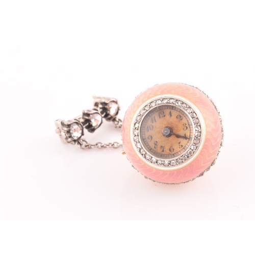 83 - A 19th century French pink guilloche enamel ball clock pendant, the Arabic numeral dial with old-cut... 