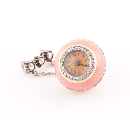 83 - A 19th century French pink guilloche enamel ball clock pendant, the Arabic numeral dial with old-cut... 