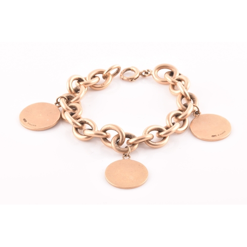 86 - A 9ct yellow gold round-link bracelet, suspended with three round medallion pendants, bearing engrav... 