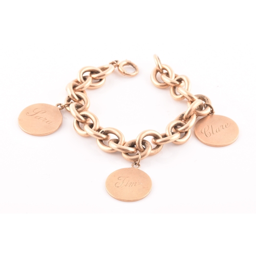 86 - A 9ct yellow gold round-link bracelet, suspended with three round medallion pendants, bearing engrav... 