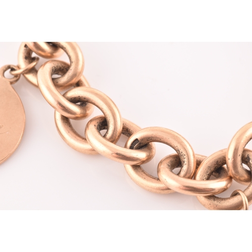 86 - A 9ct yellow gold round-link bracelet, suspended with three round medallion pendants, bearing engrav... 