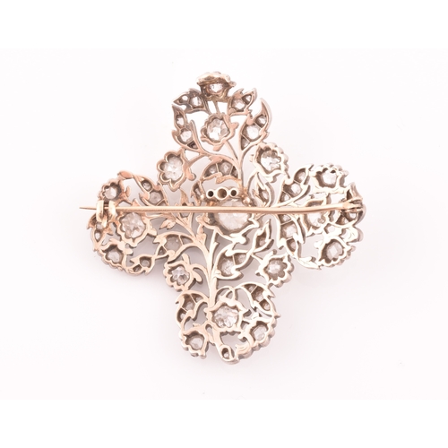 88 - A late Victorian diamond quatrefoil brooch, set with mixed old-cut diamonds, the openwork mount with... 