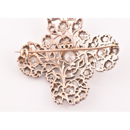 88 - A late Victorian diamond quatrefoil brooch, set with mixed old-cut diamonds, the openwork mount with... 