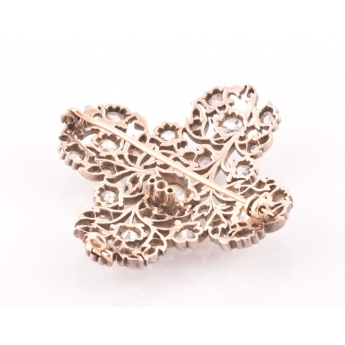 88 - A late Victorian diamond quatrefoil brooch, set with mixed old-cut diamonds, the openwork mount with... 